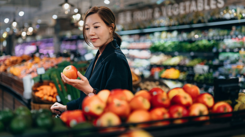 young lady shopping for fruit
