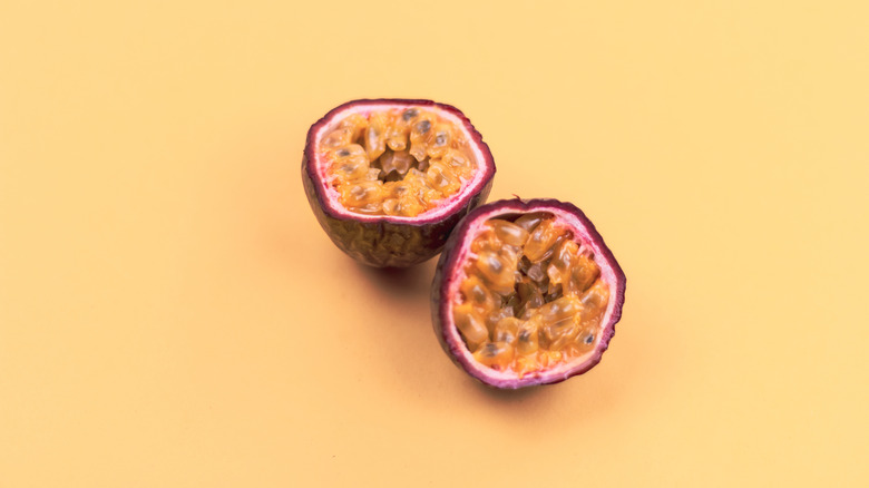 sliced passion fruit on yellow background