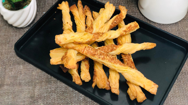 Cheese straws on a baking tray