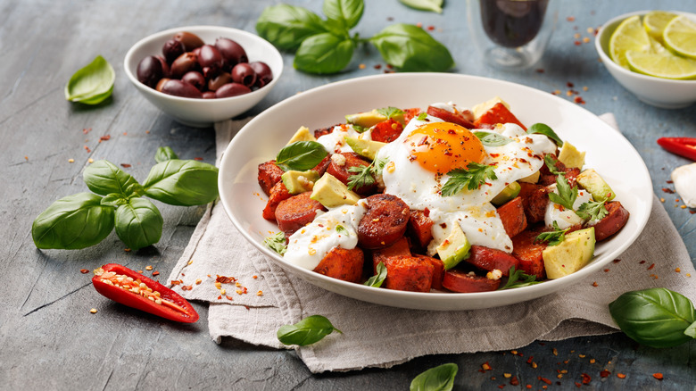 sweet potato hash with avocado and a sunny-side-up egg