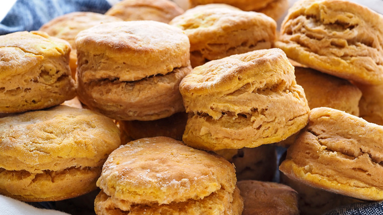 flaky, golden sweet potato buttermilk biscuits in a pile