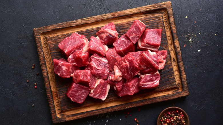 cubes of raw steak on rectangular plate