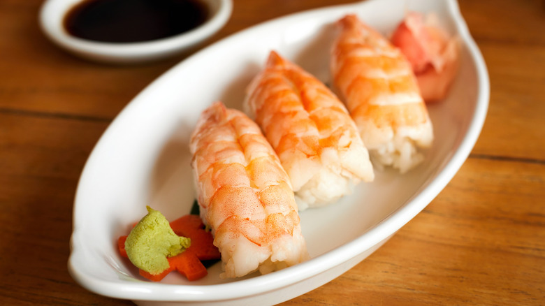 shrimp nagiri with bowl of ponzu in background