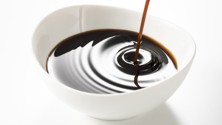 Worcestershire sauce in white bowl on white background