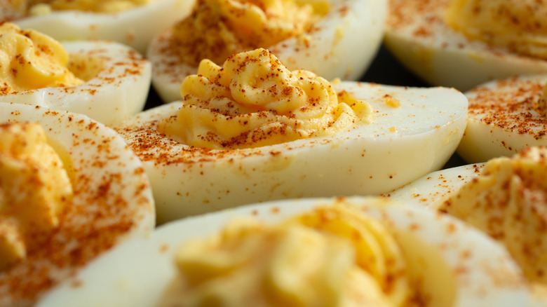 Close up of deviled eggs with paprika on top