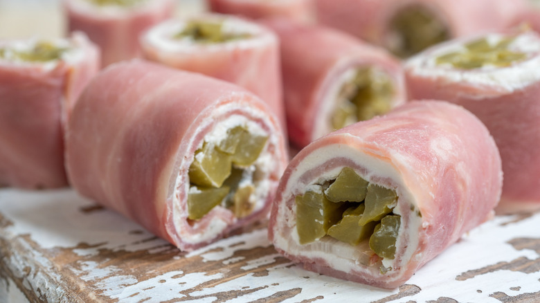 Diced pickles and cream cheese wrapped in ham