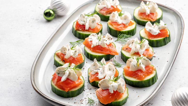 Elegant smoked salmon and cucumber bites served on a platter