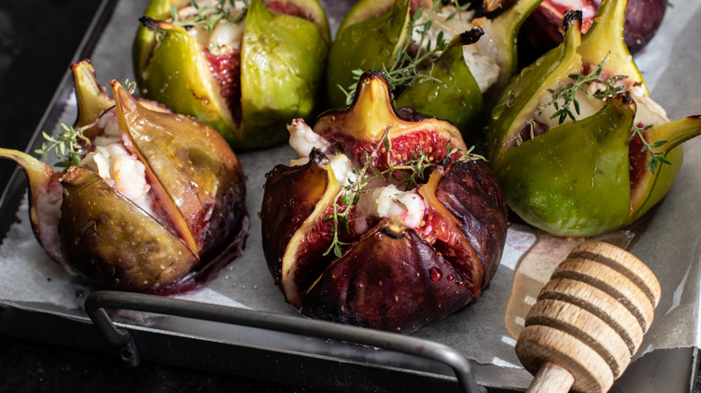 Roasted figs stuffed with goat cheese with honey drizzled over the top
