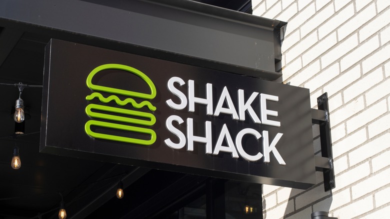 A close-up of the Shake Shack sign and logo