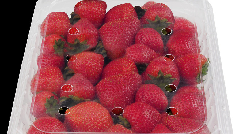 Fresh strawberries in a plastic container