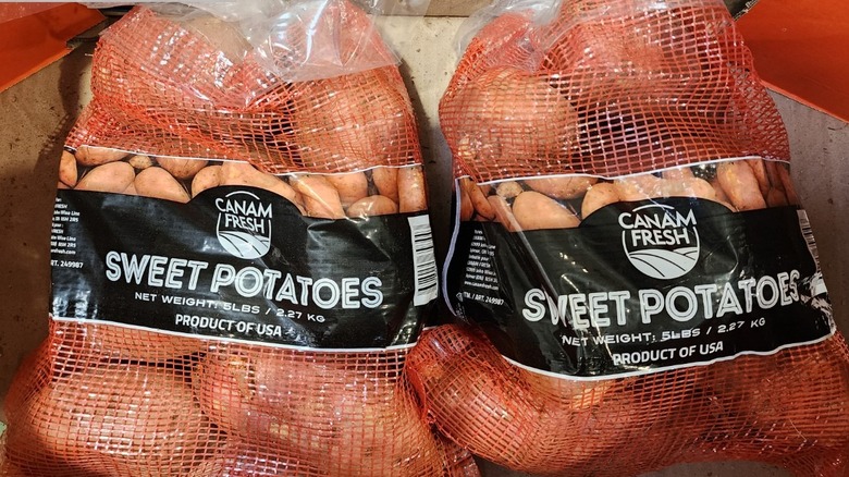 two bags of sweet potatoes at store