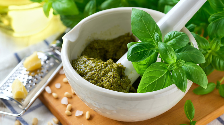 A mortar and pestle with pesto