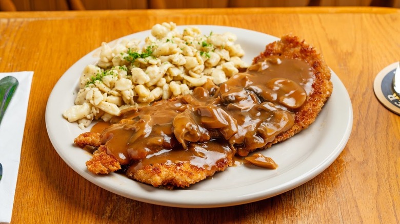 A plate of schnitzel with spaetzle at Bavarian Grill