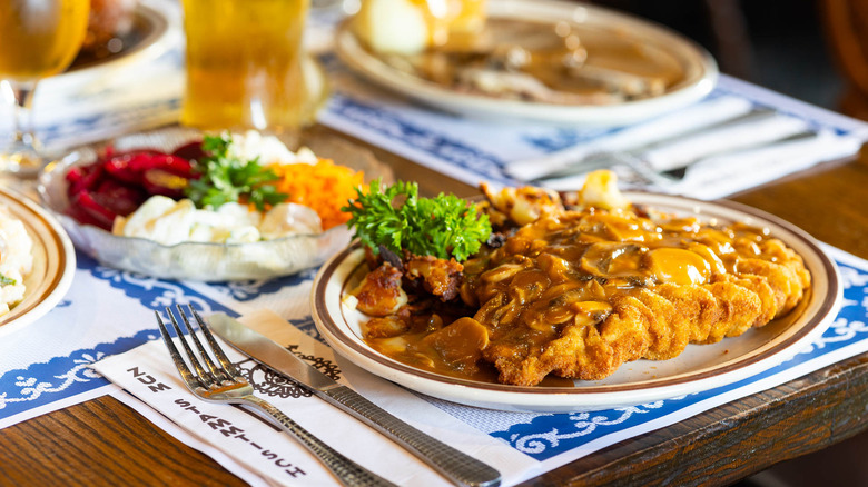 A plate of schnitzel on a table at Zum Stammtisch