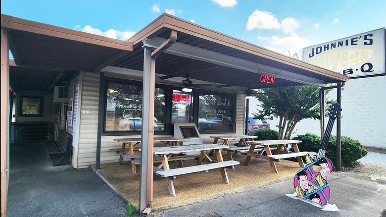 Front of Johnnie's Drive-In with picnic tables and Elvis guitar