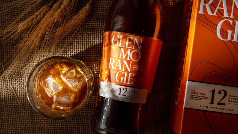 A bottle and glass of Glenmorangie The Original 12 Year next to the box packaging