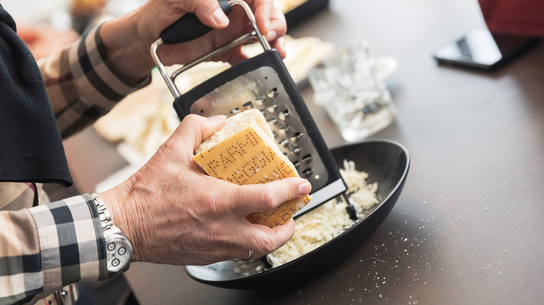 hand grating parmesan cheese