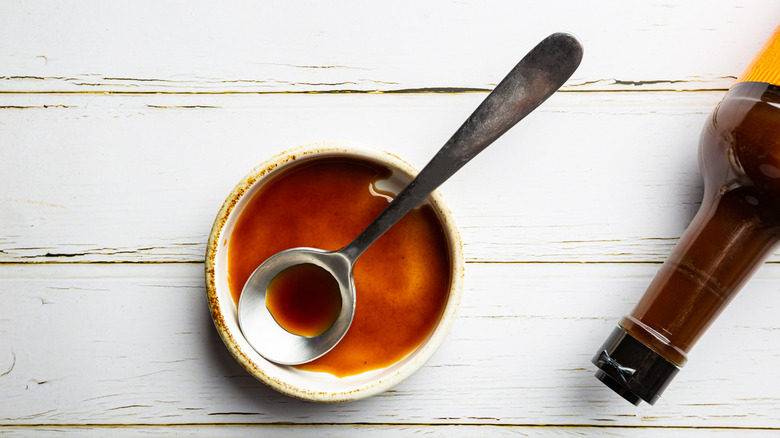bowl of Worcestershire sauce and bottle neck