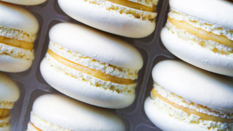 Macarons on a tray with lemon curd