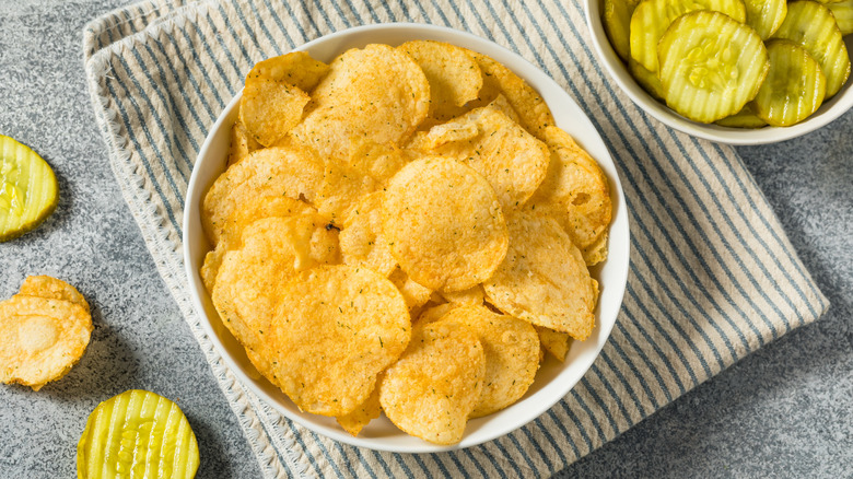Bowl of potato chips with pickles