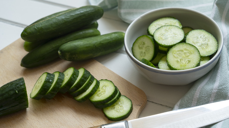 Chopped cucumbers on wooden block