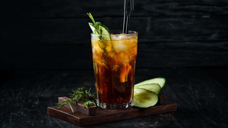 A minty cucumber rum and Coke with fresh rosemary swigs