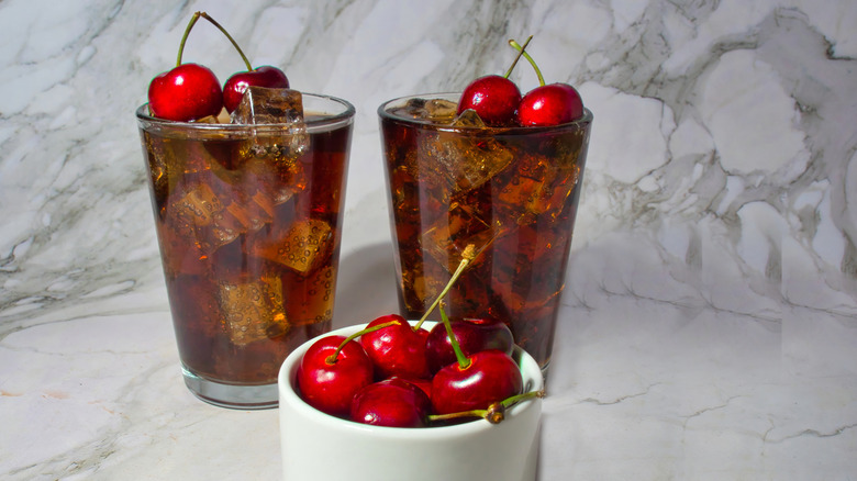 Two Roy Rogers with a bowl of fresh cherries