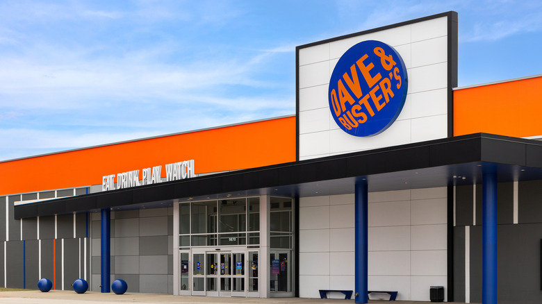 The orange and blue exterior of a Dave & Buster's restaurant