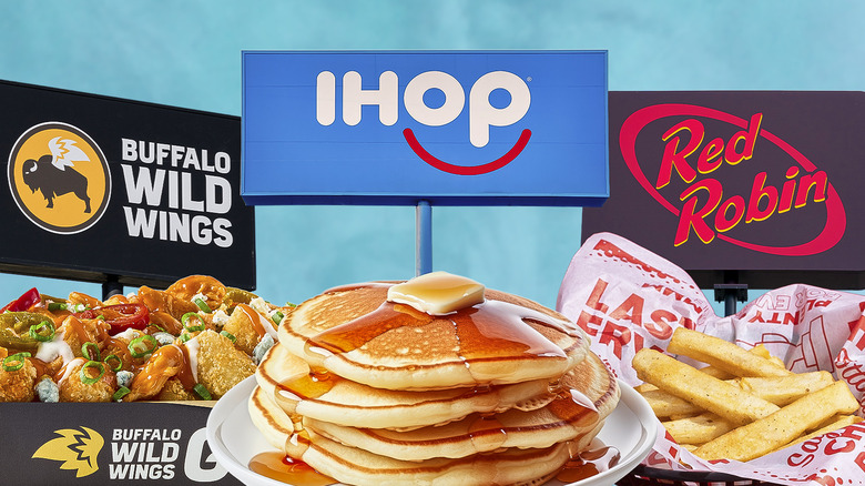 Three national restaurant chain logos in the background with baskets of food in the foreground