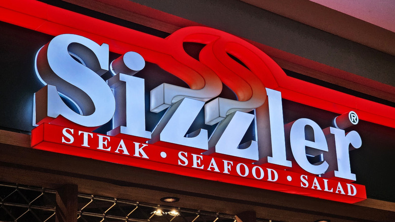 A close up of a Sizzler restaurant sign