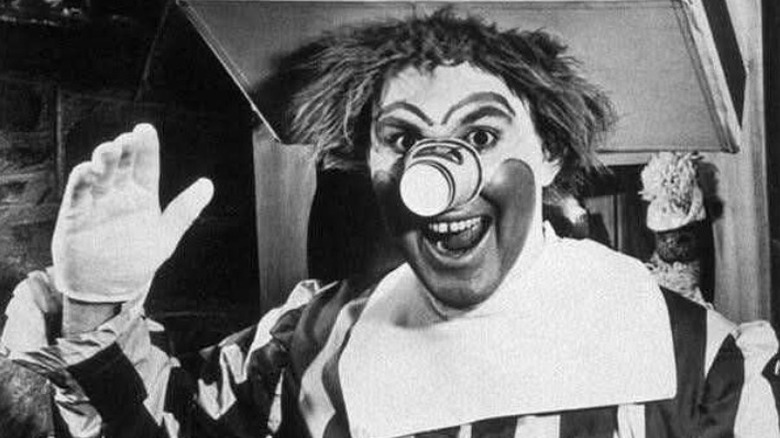 Still showing the original Ronald McDonald played by Willard Scott in the clown's TV introduction; Ronald is wearing a tray and drink for a hat
