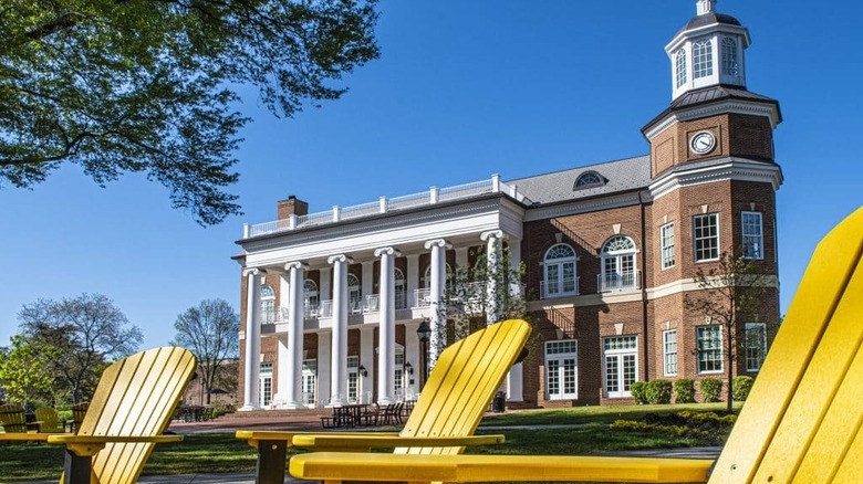 One of the buildings on the RMC campus with yellow lawn chairs out front