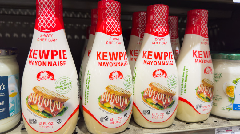 Bottles of Kewpie mayo on a store shelf