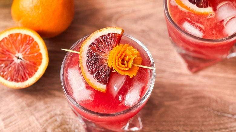 Fruity and fun blood orange crush cocktails on wooden table