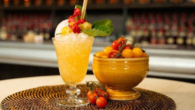 Maker's Mark bourbon and vanilla tomato water cooler and bowl of tomatoes