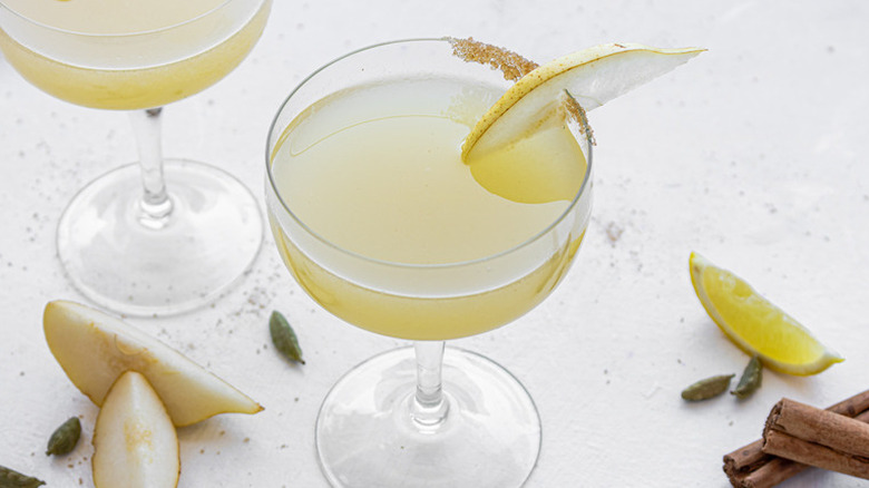 two sugar and spice pear martinis with pear garnish