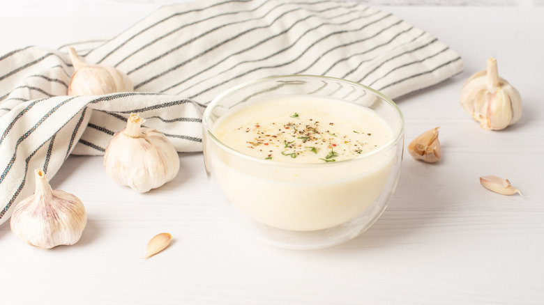 Aioli in a bowl with a towel