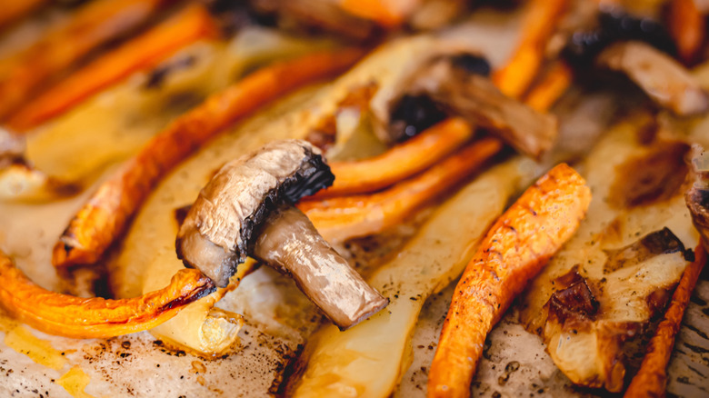 Roasted peppers and mushrooms on a baking sheet