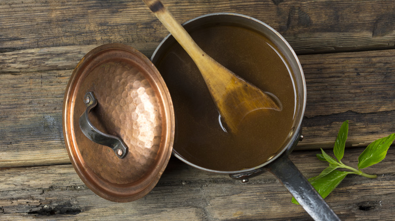 Making pan sauce in a metal pot