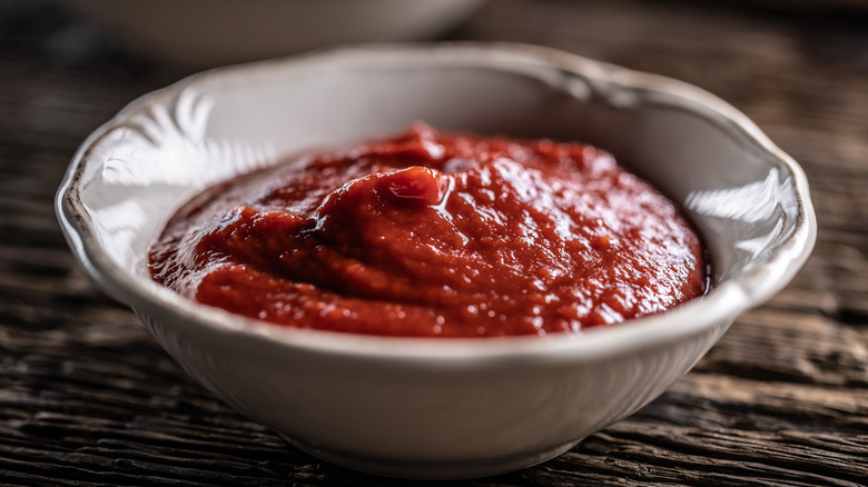 White bowl of ketchup