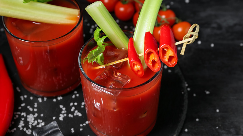 Bloody mary cocktails in glasses with garnishes