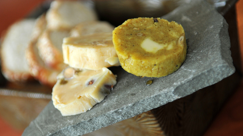 Compound butter rounds on piece of granite