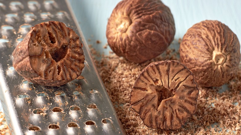 Nutmegs grated on a grater