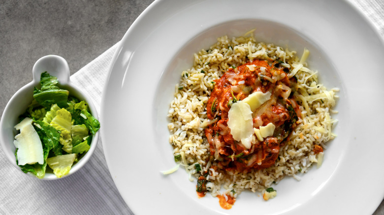 Cauliflower rice with sauce and salad