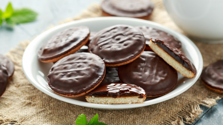 Chocolate-frosted Jaffa cakes on a plate