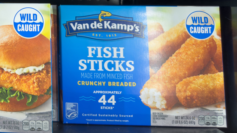 box of fish sticks sitting on a grocery store shelf