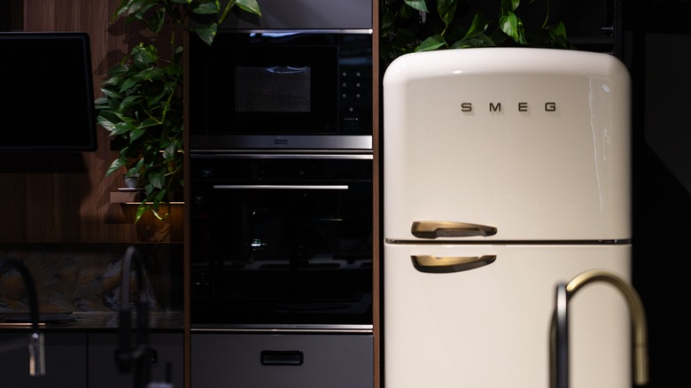 SMEG fridge with greens and wooden accents