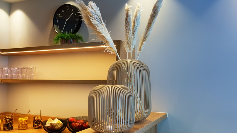 Shelf with decorative vases and accent lights