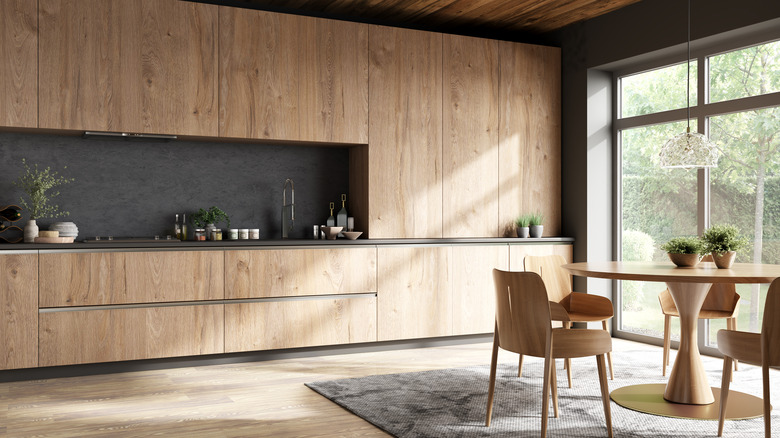 Mid century modern dining room with wood paneled cabinets