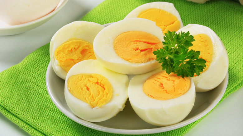 Hard-boiled eggs on plate